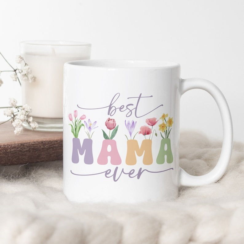 Best Mama Ever mug with floral sublimation design featuring “Best Mama Ever” and wildflowers, on a white background