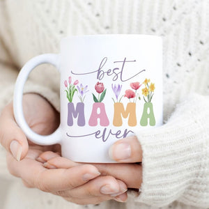 Best Mama Ever mug with vintage floral wildflower design, held by hands in a cozy sweater