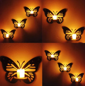 Butterfly wall decor with warm LED wall lights, elegant butterfly shaped wall lamps creating soft ambient lighting on textured wall.