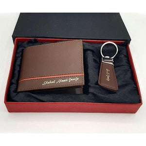 Customized wallet with name in golden text and matching keychain, displayed in a red gift box with black lining