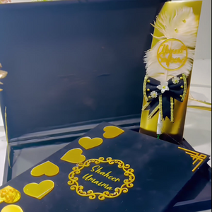 Customized Nikah velvet book kit with "Shaheer & Umaima" text, featuring gold heart accents and a decorative Nikkah pen with feathers, in a velvet box