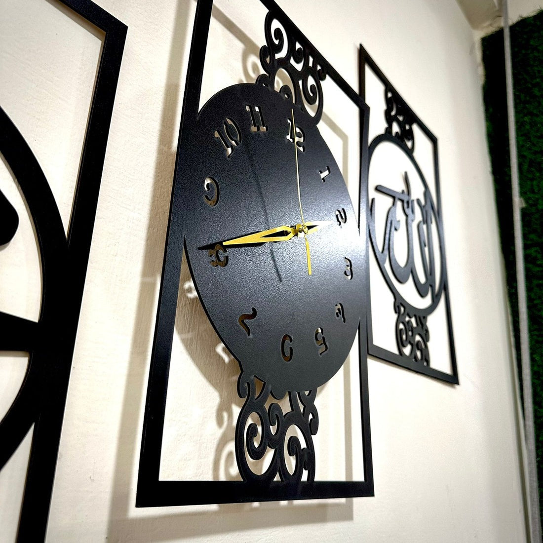 Islamic Allah Muhammad (SAW) Calligraphy Wall Clock with Arabic design, displayed in a modern living room above a sofa – a spiritual decor piece from GiftStudio.shop.