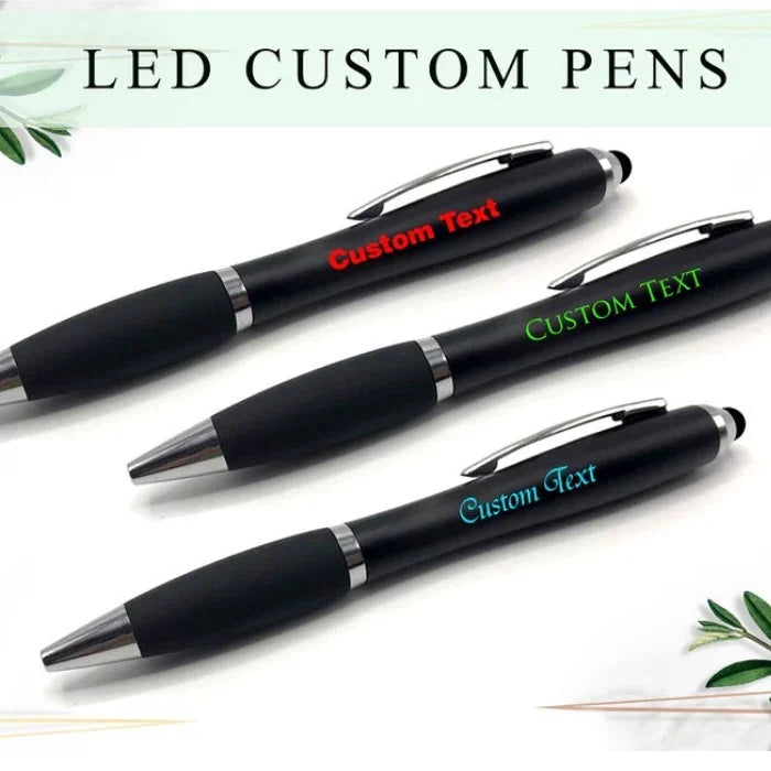 Three LED custom pens with different colored text ("Custom Text") engraved on the barrel.