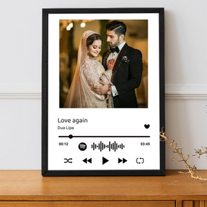 Customizable lyrical keepsake frame with a wedding photo and "Love Again" by Dua Lipa, featuring a Spotify waveform, displayed on a wooden surface