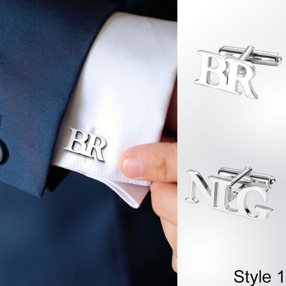 Personalized silver cufflinks with "BR" and "NIG" initials in Style 1, displayed on a gradient gray background