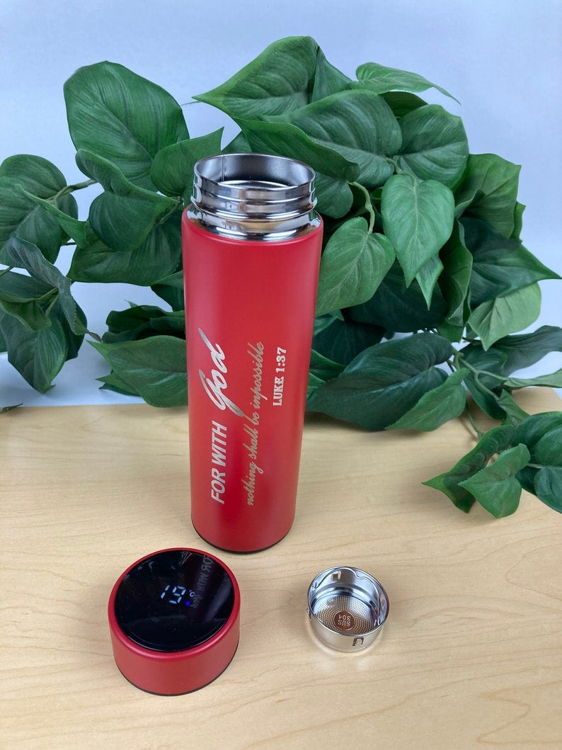 Red insulated travel mug with a temperature display feature and sleek design