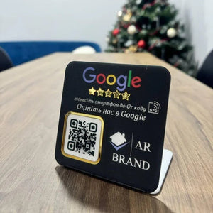 Black acrylic Google review NFC and QR code sign for businesses, with a gold-trimmed scannable QR code.