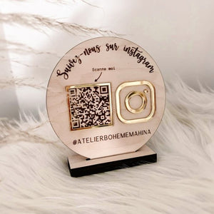 Custom wooden social media sign featuring a QR code and gold acrylic Instagram logo on a black base, ideal for promoting business accounts.