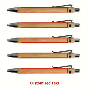 A set of four personalized bamboo pens, each featuring custom engraved text, arranged neatly on a wooden background.