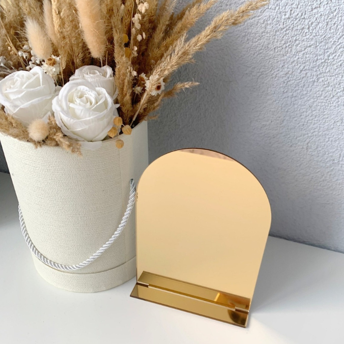Gold mirror acrylic arch blank sign with stand, perfect for luxury wedding or event signage.