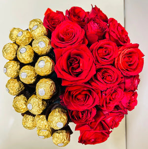 Top view of a heart-shaped gift box featuring fresh red roses and Ferrero Rocher chocolates, arranged elegantly for a romantic gift.