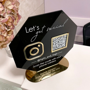 : Sleek black hexagonal acrylic QR code sign with gold accents, designed for business social media promotion.