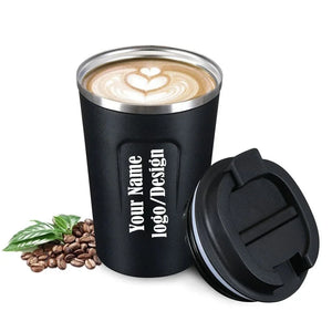 Black stainless steel personalized coffee mug with a custom engraved name/logo, featuring a spill-proof lid and coffee beans.