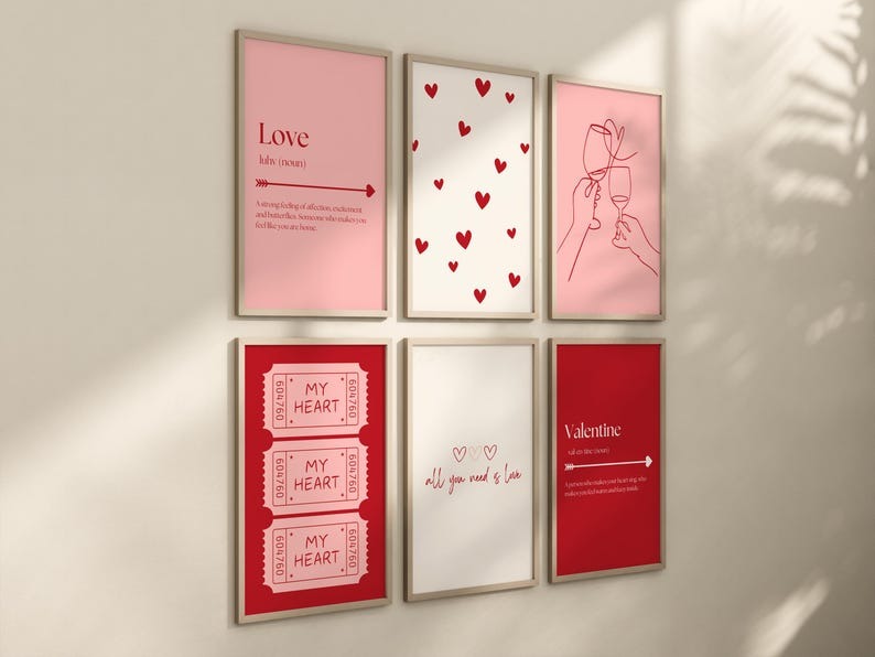 A set of six framed Valentine's Day wall art prints in pink and red tones, featuring love quotes, heart patterns, and romantic minimalist illustrations.