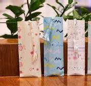 Cute floral and patterned gift bags for customized presents, perfect for Nikah or photo frame gifts