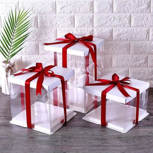Elegant white gift boxes with red ribbons, perfect for customized gifts and same-day delivery in Gujranwala