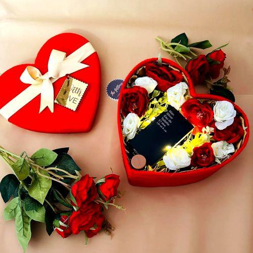 Red heart-shaped gift box with red and white roses, LED lights, and a love note — perfect for Nikah or romantic gifts.