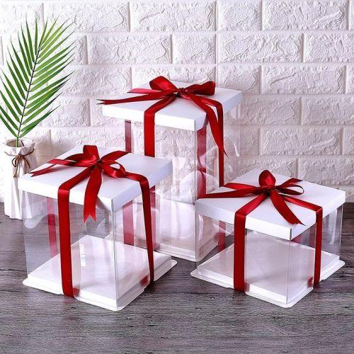 Elegant white gift boxes with red ribbons, perfect for customized gifts, photo frames, or gift baskets