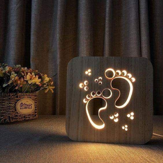Wooden LED night light with glowing baby footprints, perfect for nursery decor or baby shower gifts