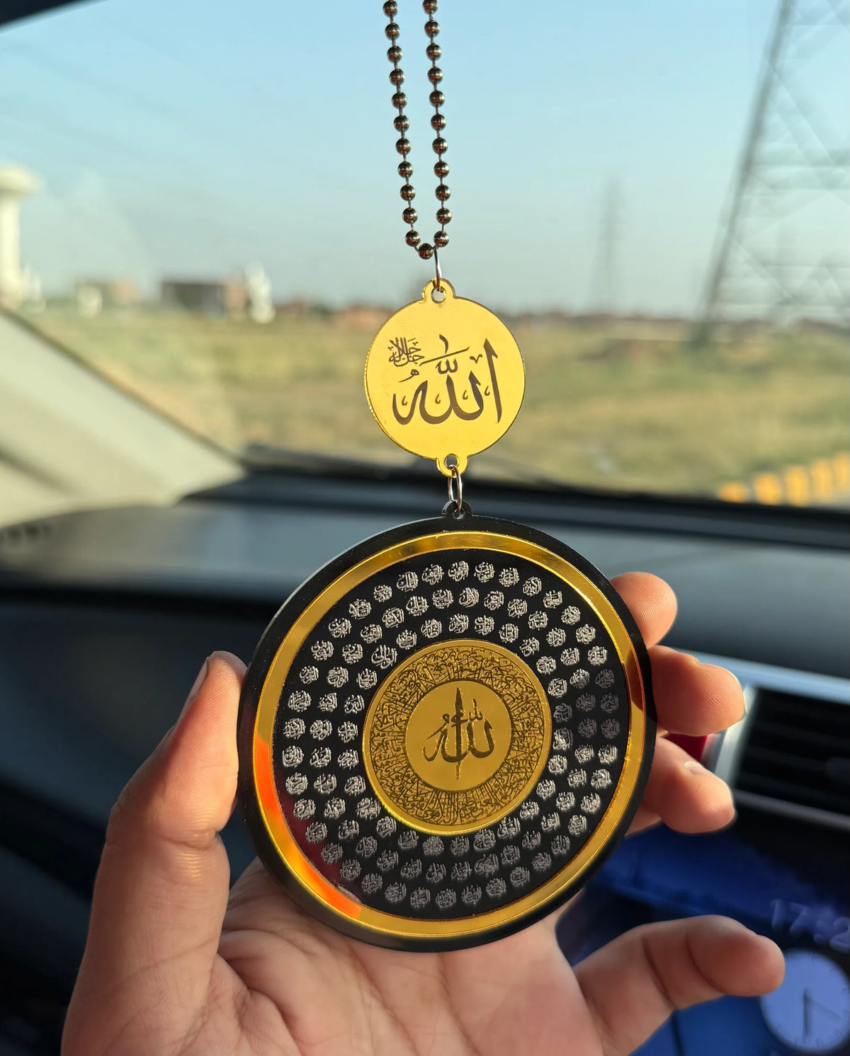 99 Names of Allah car hanging close-up calligraphy detail