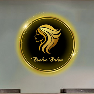 Custom beauty salon neon sign with "Evolve Salon" text and glowing silhouette, mounted on a wall above a wooden reception desk in a modern salon

