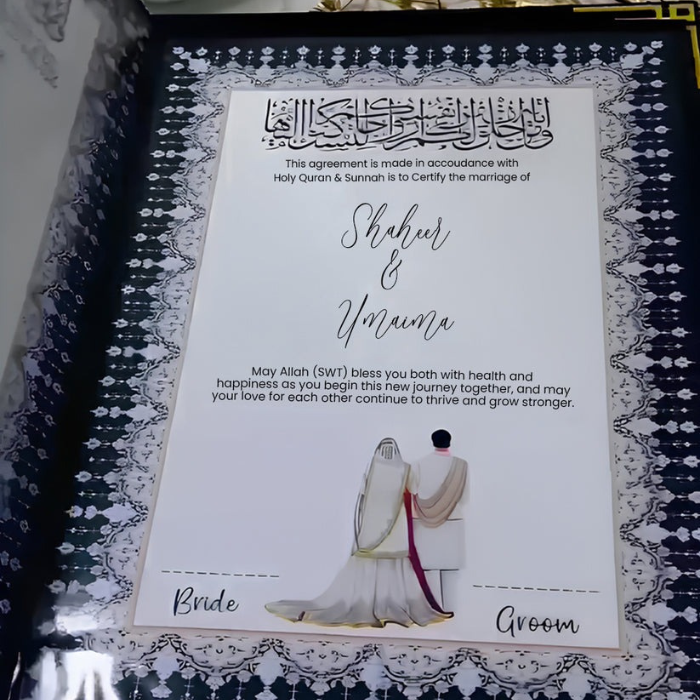 Open customized Nikah velvet book kit with "Shaheer & Umaima" text, featuring Islamic calligraphy, floral designs, and a bride and groom illustration, held by a hand