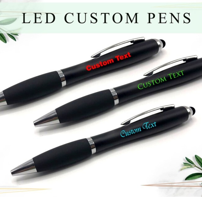  Three LED custom pens with different colored text ("Custom Text") engraved on the barrel.