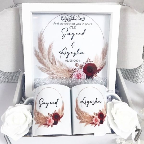 Luxury personalised couples hamper with 8x8 inch frame, 2 custom mugs, and white roses, packaged in a box.