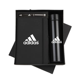 Black corporate gift set with a notebook, pen, and thermal bottle featuring a custom logo.