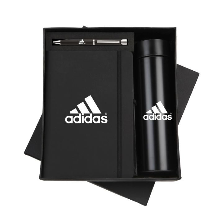 Black corporate gift set with a notebook, pen, and thermal bottle featuring a custom logo.