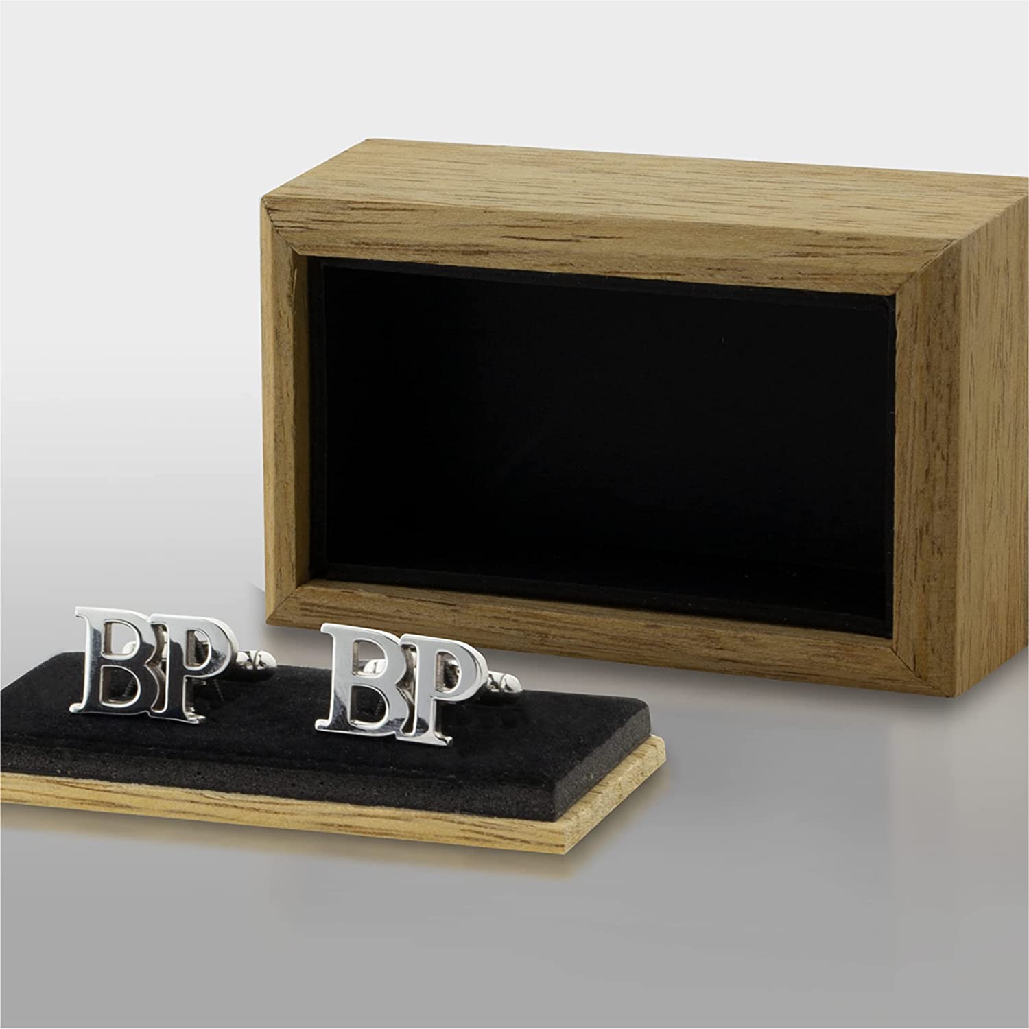 Personalized silver cufflinks with "BP" initials, displayed in a wooden gift box with black lining