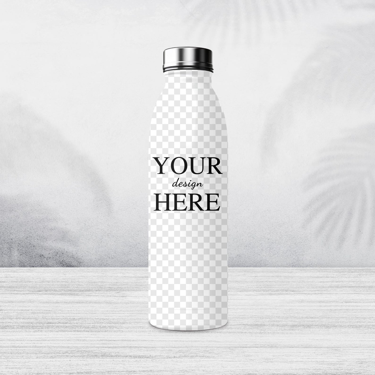 Custom stainless steel water bottle with 'Your Design Here' text displayed on a wooden surface with a serene ocean backdrop.