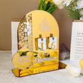  Elegant Ramadan Countdown Calendar displayed on a table with yellow tulips and other decorative elements.