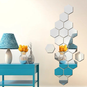 Silver acrylic hexagon wall decor mirror with a reflective finish, displayed on an office wall above a desk with a chair