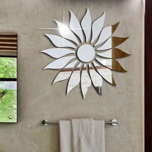 Silver Sunflower acrylic mirror with a mirror-like effect, displayed on a white wall with decorative elements