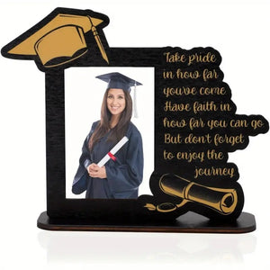 Wooden graduation photo frame with inspirational quote and cap design, vertical desktop display holder for grads, placed on a wooden surface