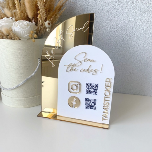Customizable acrylic social media QR code sign in gold and white, helping businesses attract and retain customers by simplifying online connections.