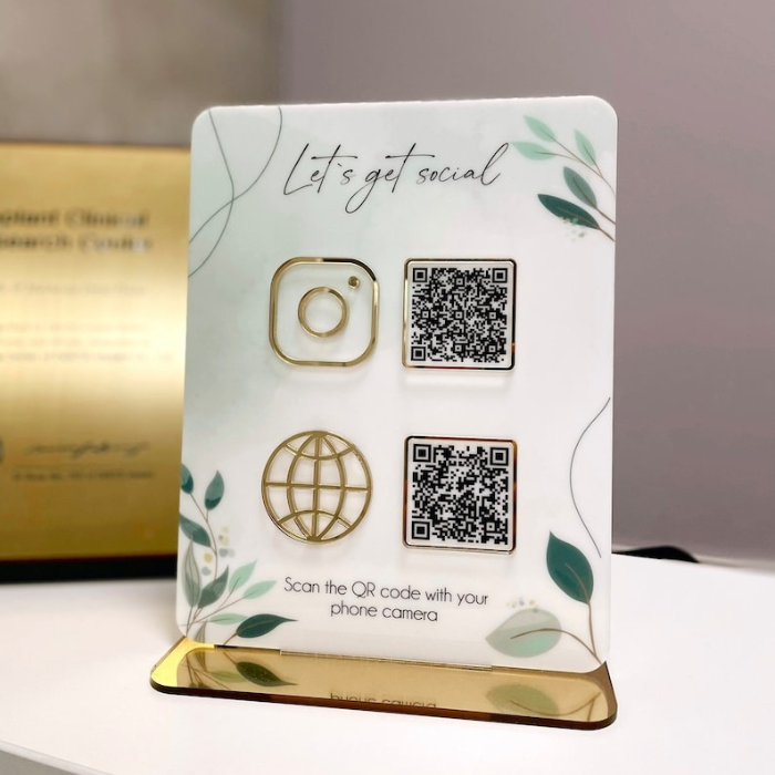  Elegant gold-accented acrylic social media QR code sign with Instagram and website icons for business promotion.