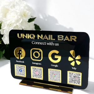 Black acrylic social media QR code sign with gold icons for Facebook, Instagram, Google, and Yelp, designed for business marketing and customer engagement.