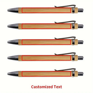  A set of four personalized bamboo pens, each featuring custom engraved text, arranged neatly on a wooden background.