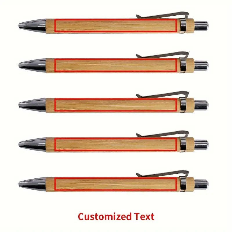  A set of four personalized bamboo pens, each featuring custom engraved text, arranged neatly on a wooden background.