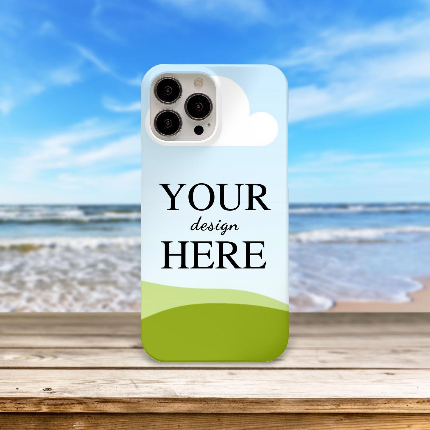 Customized mobile phone case with 'Your Design Here' displayed against a beach and ocean backdrop.