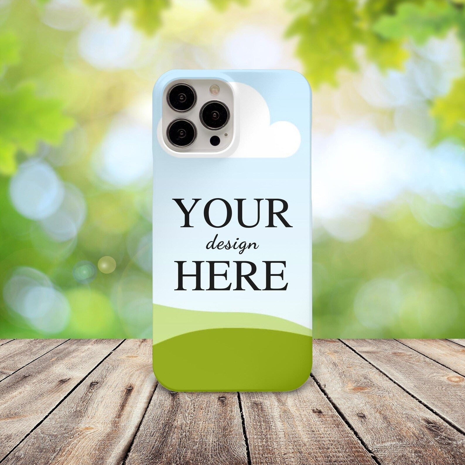 Customized mobile cover with a unique design reading 'Your Design Here,' displayed in a natural outdoor setting.
