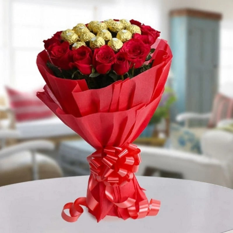 Luxurious bouquet featuring 16 Ferrero Rocher chocolates and 16 red roses, elegantly wrapped in red sheet packing with ribbon.
