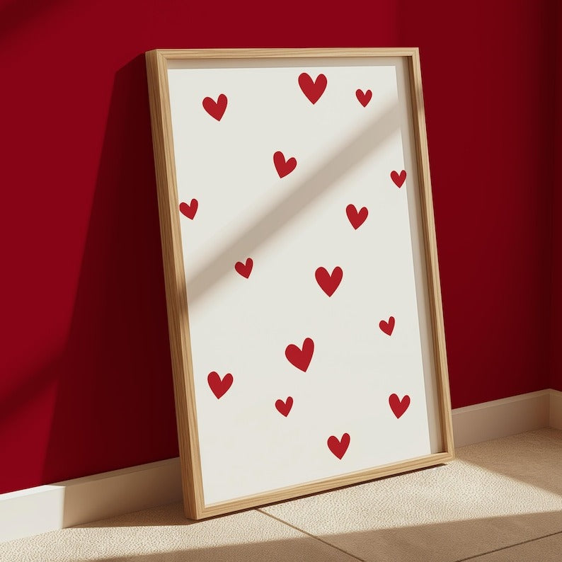 Scattered red hearts design on a neutral background, creating a modern and romantic home decoration piece.
